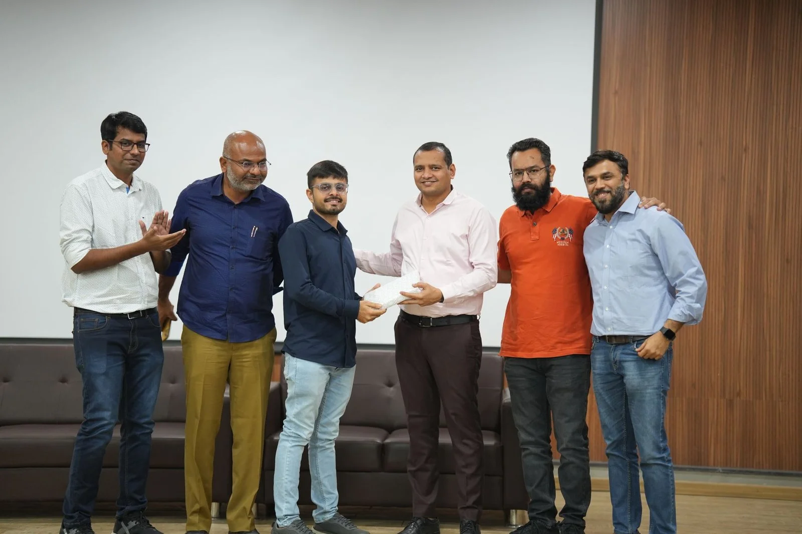 ADMM co-founders on stage presenting an award to Parth Suba ADMM co-founders on stage presenting an award to Parth Suba